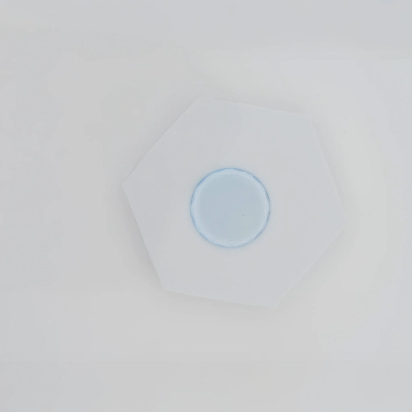 Crystal jade stone for eyelash extensions with adhesive drop, cooling surface preserves glue freshness, essential tool for lash application, The Lash Box Shop.