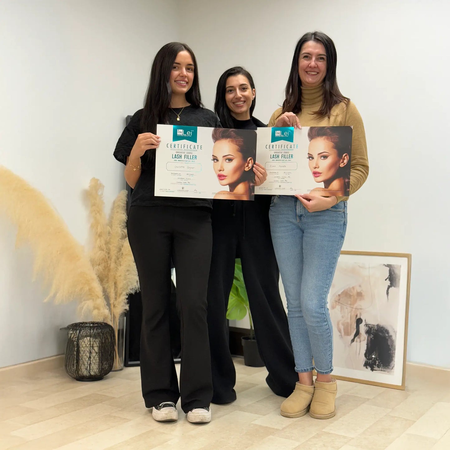 Students proudly holding Lash Filler 25.9 training certificates at The Lash Box Academy in Manchester