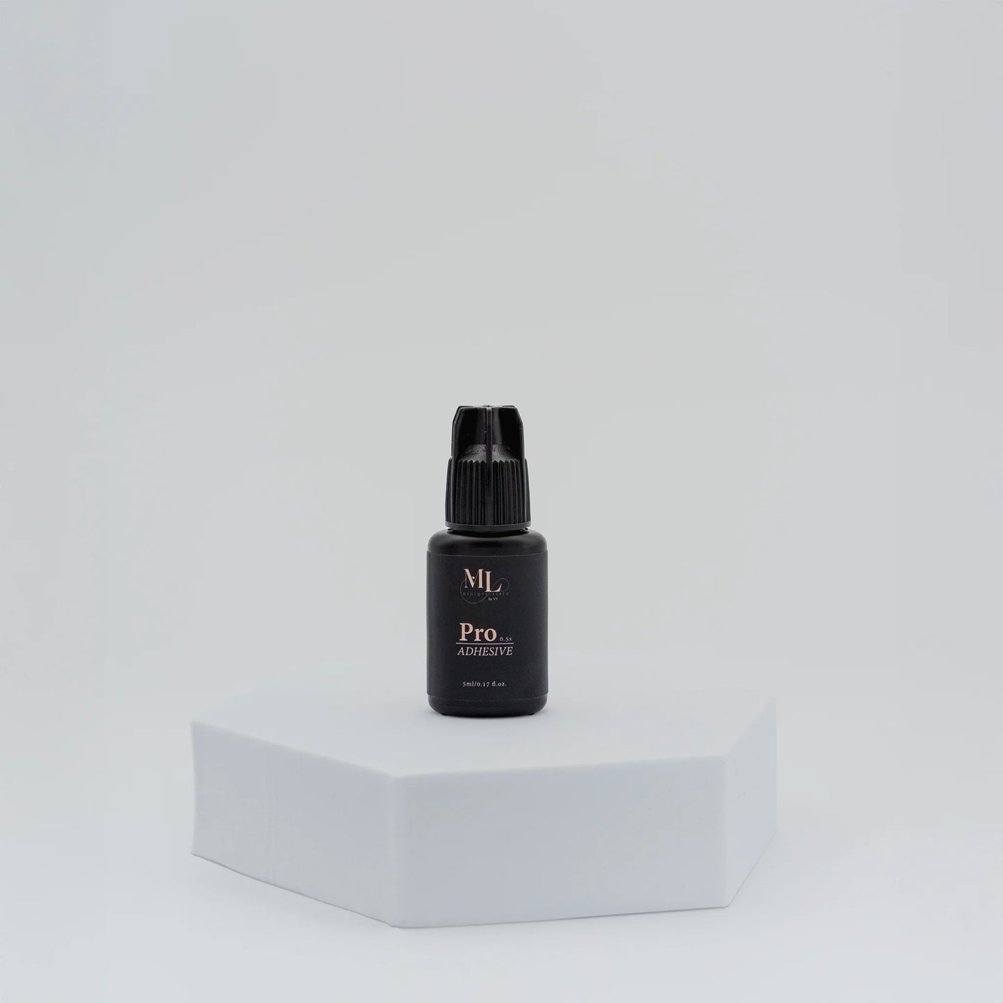 Pro Lash Adhesive for eyelash extensions, standing bottle display, ultra-fast drying lash glue for classic, volume, and hybrid lash application, The Lash Box Shop.
