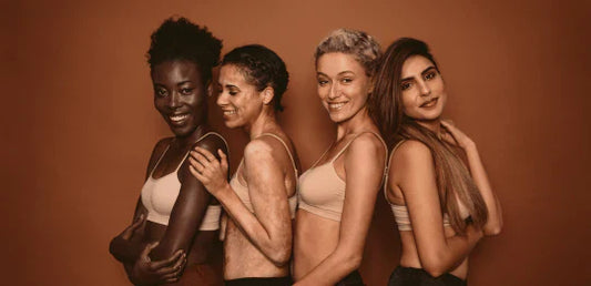 Group of diverse women smiling together, representing confidence, inclusion, and the emotional impact of a luxurious lash experience