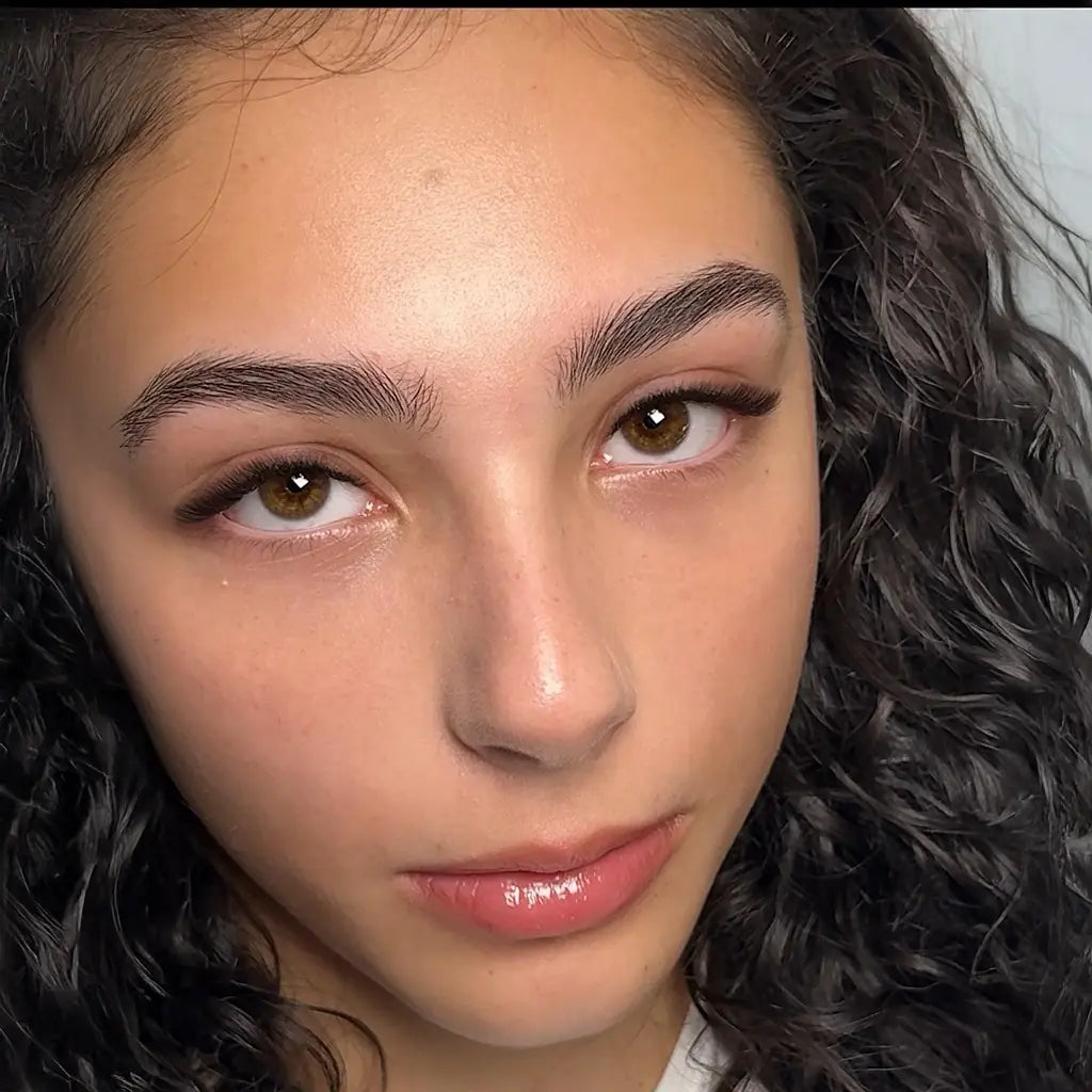 Close-up of a model wearing a natural lash set, showcasing clean lash styling and healthy skin for beauty branding content