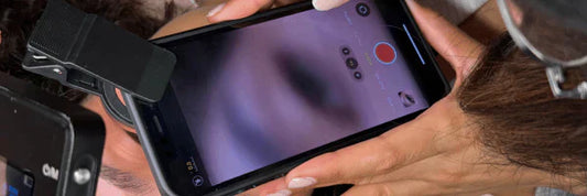 Lash artist recording lash content on phone to grow business during slow months