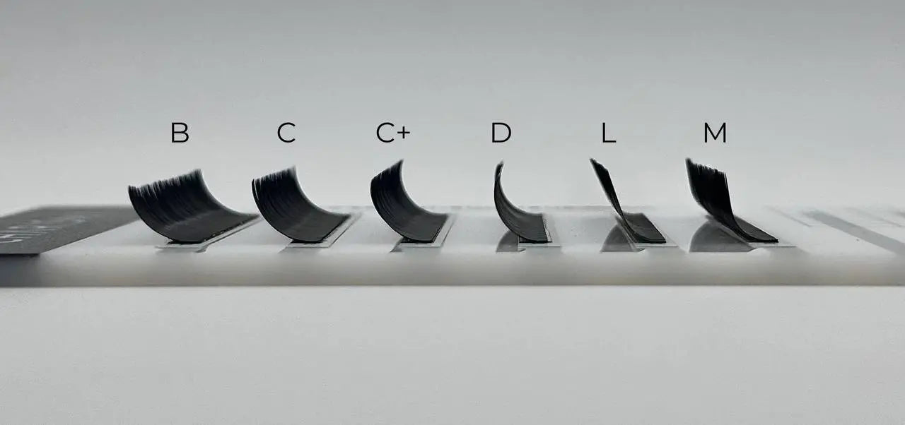 Side profile view of CHARISMA black lash tray showing curls B, C, C+, D, L, and M – ideal for customized lash sets