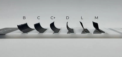 Side profile view of CHARISMA black lash tray showing curls B, C, C+, D, L, and M – ideal for customized lash sets