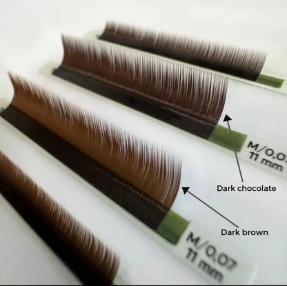 Close-up of CHARISMA dark brown eyelash extensions – smooth fibre and sticky green tape for fan creation