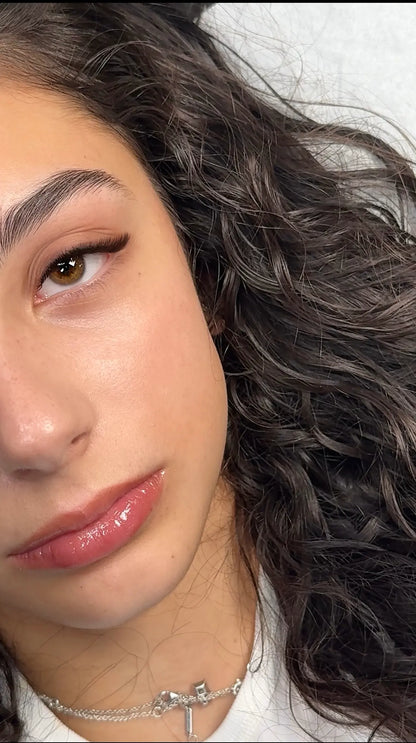 Model wearing CHARISMA dark brown eyelash extensions – soft, natural lash look for everyday sets