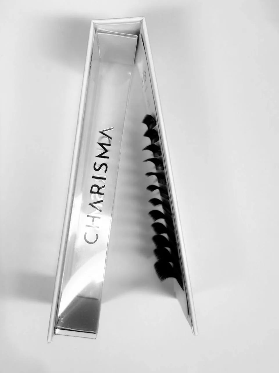 side view of CHARISMA premade lash fans tray showing narrow base volume eyelash extensions ready for professional application