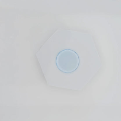 Crystal jade stone for eyelash extensions with adhesive drop, cooling surface preserves glue freshness, essential tool for lash application, The Lash Box Shop.