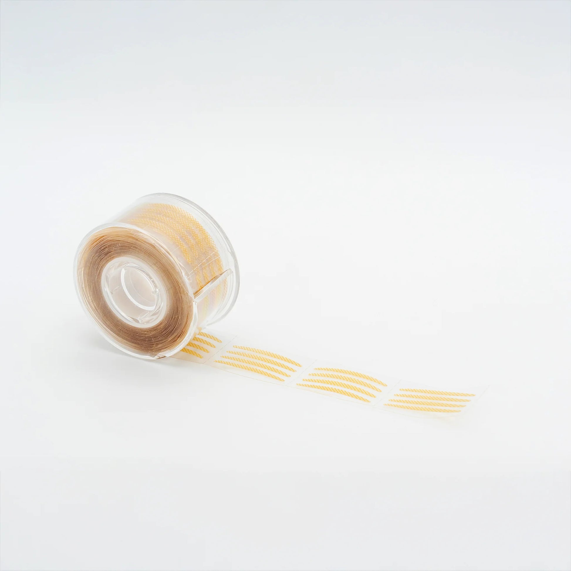 Pre-cut eyelid tape for eyelash extensions, ultra-thin adhesive strips designed to lift eyelids and isolate inner corner lashes, lash artist essential, The Lash Box Shop.