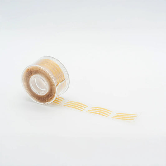 Pre-cut eyelid tape for eyelash extensions, ultra-thin adhesive strips designed to lift eyelids and isolate inner corner lashes, lash artist essential, The Lash Box Shop.
