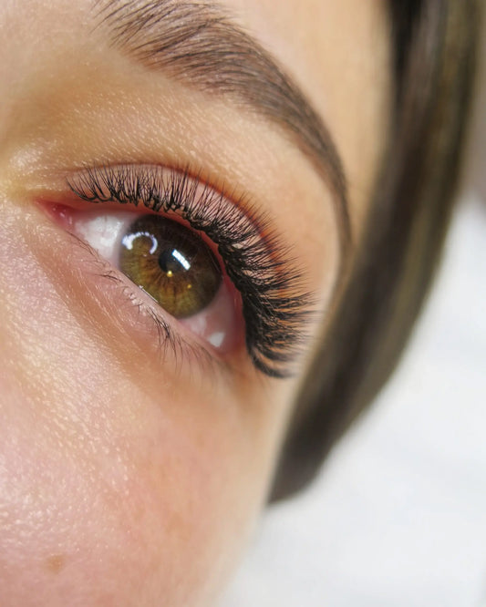 Natural lash extension set using 6D–8D fans, perfect for clients trying volume lashes for the first time