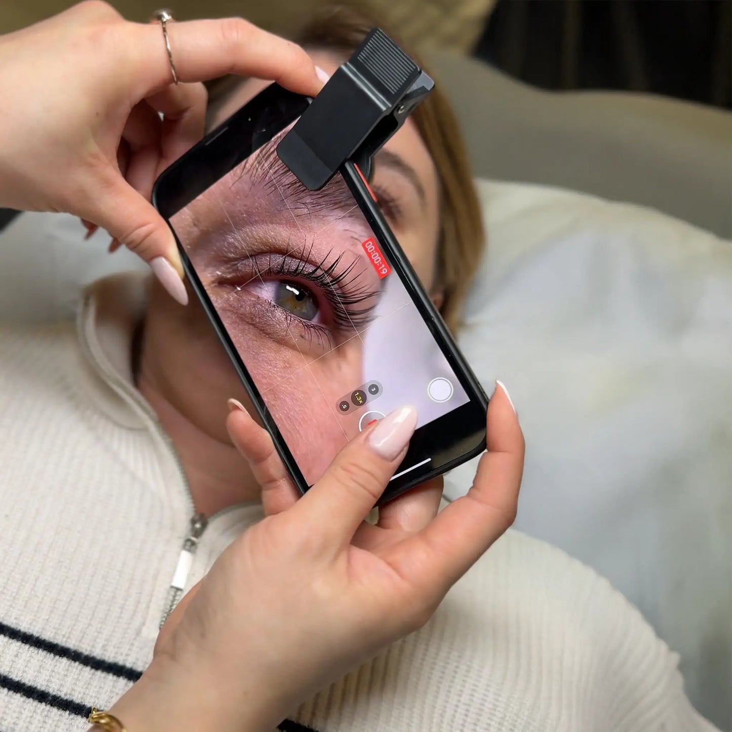 Lash artist recording a close-up of a client’s lashes after InLei® Lash Filler treatment