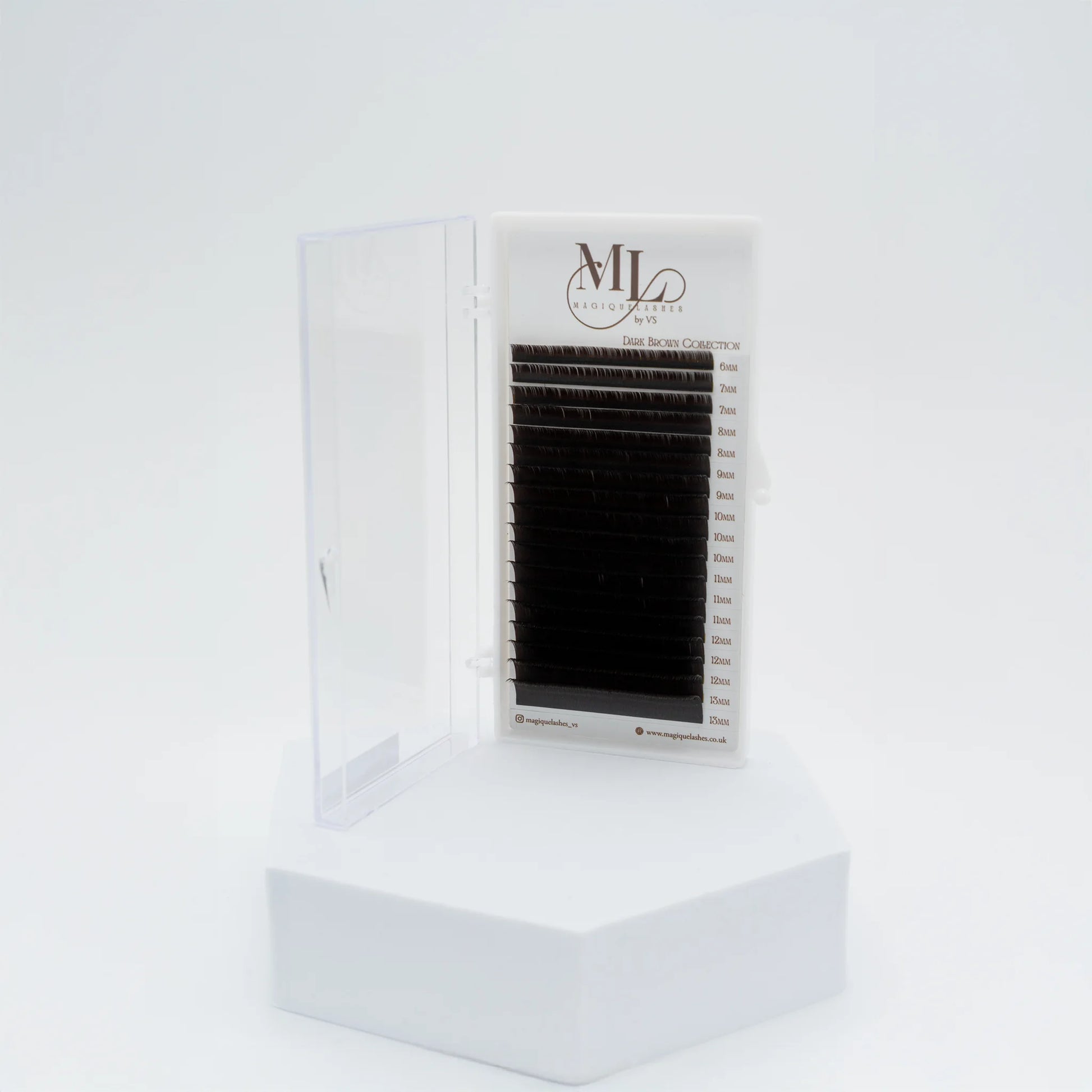 MAGIQUE Espresso brown eyelash extensions tray displayed upright in open case on a white pedestal.
