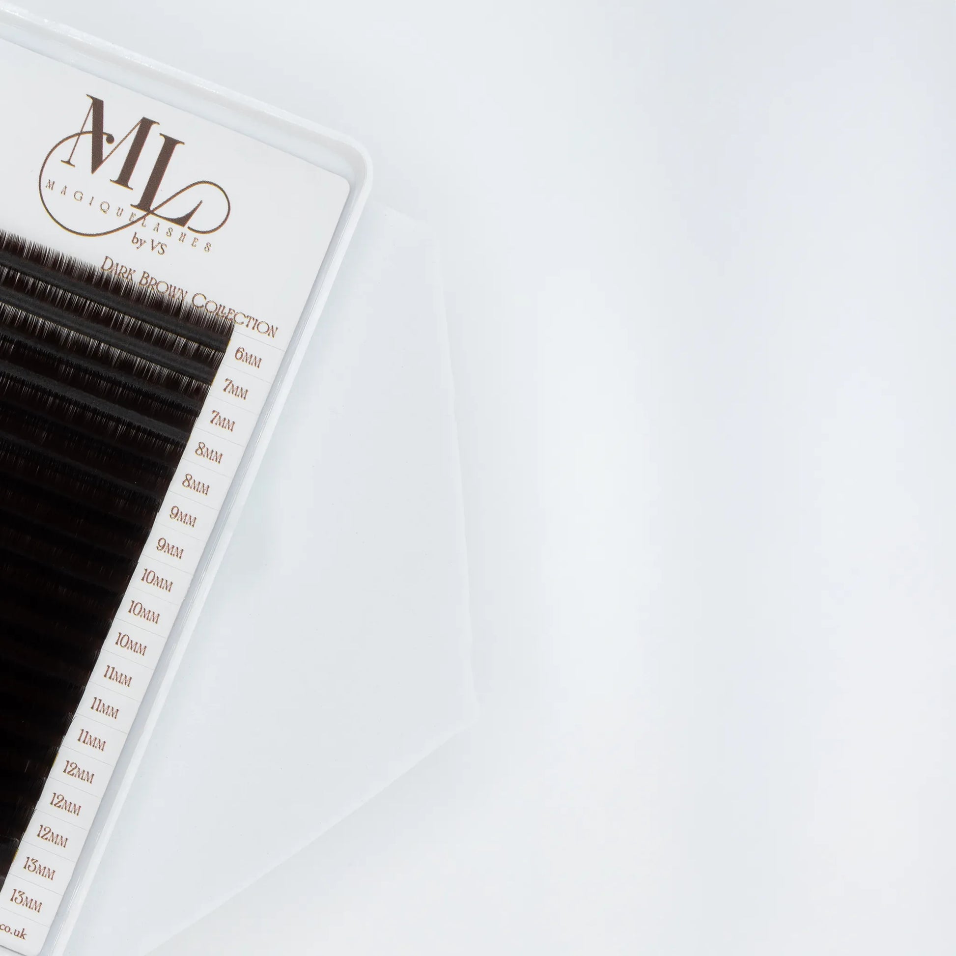 Close-up of MAGIQUE Espresso brown eyelash extensions tray, showing detailed length labels from 6mm to 13mm.