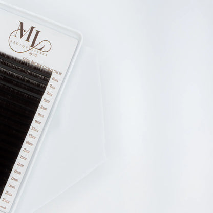 Close-up of MAGIQUE Espresso brown eyelash extensions tray, showing detailed length labels from 6mm to 13mm.