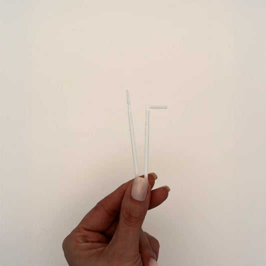 Micro brushes with bendable tip for lash extensions, displayed in hand, ideal for applying cleansers, primers, and removers during lash pre-treatment, The Lash Box Shop.