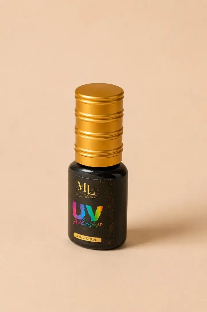 ML UV LED lash adhesive black 5ml shown at an angle on a beige background