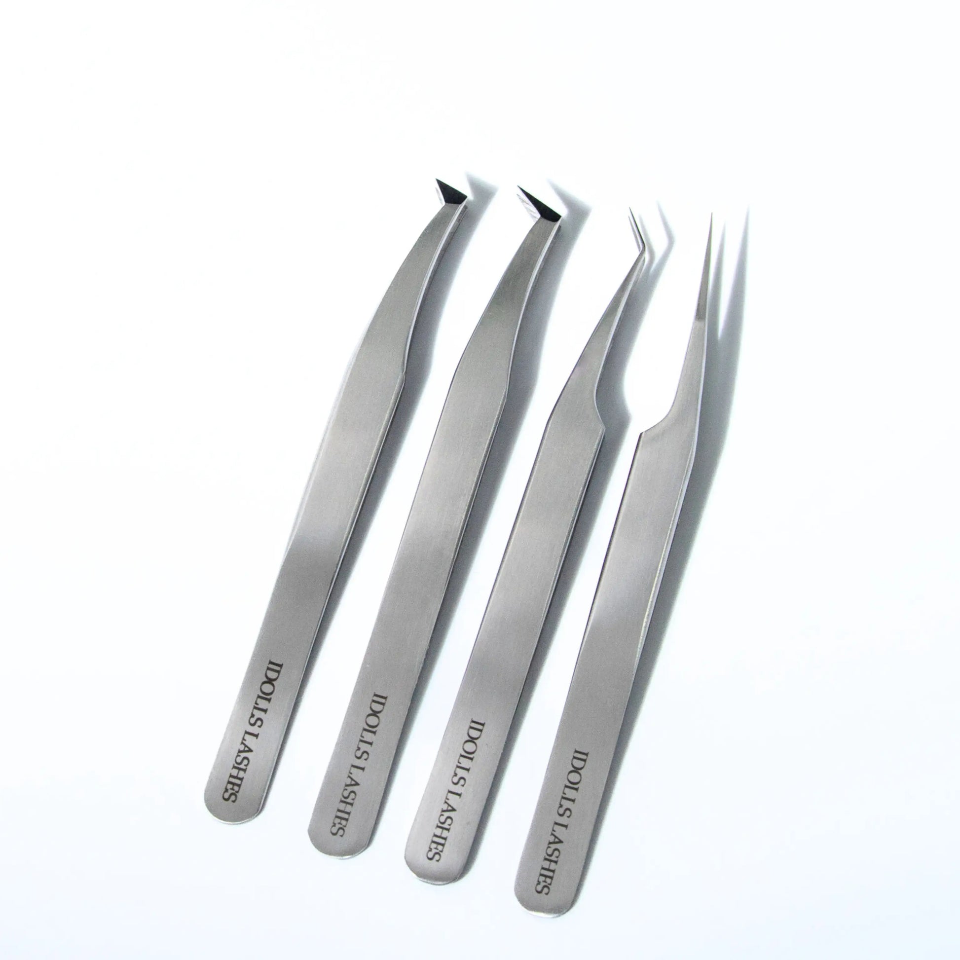 Full set of professional eyelash extension tweezers by iDolls Lashes – includes precision, straight, multifunctional, and volume tweezers